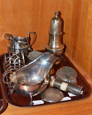 Lot 258 - A collection of silver including two toast racks, a sauce boat, a sugar caster, a George III...