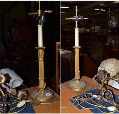 Lot 266 - Pair of early 20th century gilt metal table lamps and a pair of Rococo style two branch wall lights