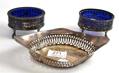 Lot 271 - Pair of silver table salts with blue glass liners and a pierced oval dish (3)