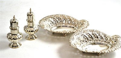 Lot 280 - A pair of silver pierced oval dishes, Sheffield Assay and a pair of Walker & Hall silver...