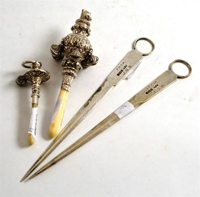 Lot 282 - A pair of silver meat skewers, Sheffield 1907, a Victorian silver child's rattle hung with six...