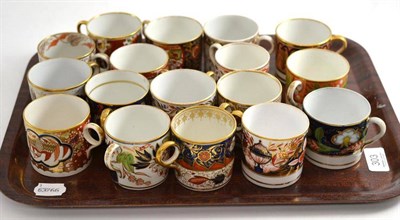 Lot 303 - Seventeen 19th century gilt decorated coffee cans including Coalport and Minton