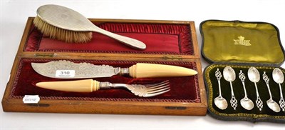 Lot 310 - Six silver teaspoons in fitted case, silver hand brush and Victorian ivory handled servers in...