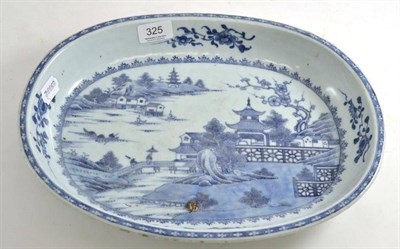 Lot 325 - A Chinese blue and white large shallow dish of oblong form, firing fault