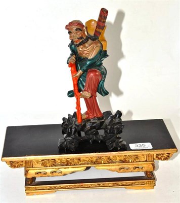 Lot 335 - An Antique Chinese wood figure and a lacquer wood Chinese miniature altar table/stand