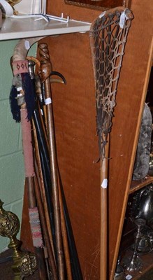 Lot 378 - Group of nine assorted walking sticks including an antique sword stick, some with silver...