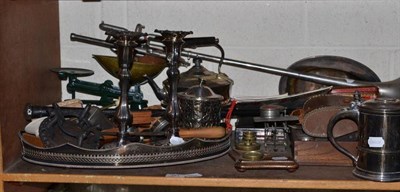 Lot 381 - A shelf of silver plate and ornamental items including a set of postal scales and weights, pair...