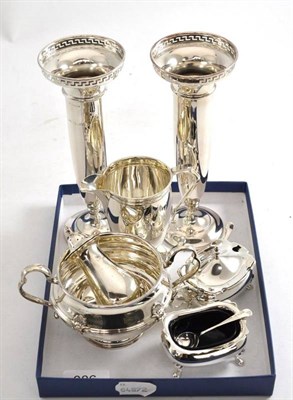 Lot 386 - A pair of silver plated vases, silver cream jug, sugar basin, pepperette and two salts