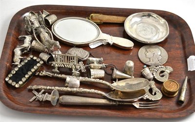 Lot 394 - A collection of English and Continental silver including anointing spoons, thimbles, hand...