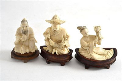 Lot 412 - Three early 20th century carved ivory figures on stands