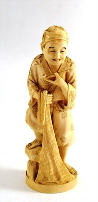 Lot 420 - Late 19th/early 20th century Japanese ivory figure of a man with a pipe