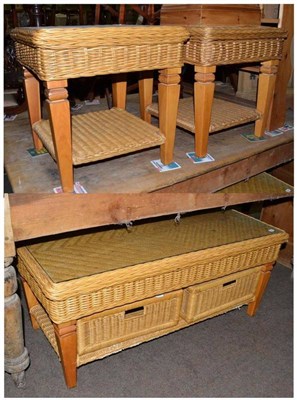 Lot 522 - Pair of cane and glass top lamp tables and a matching coffee table fitted with two baskets...