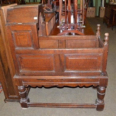 Lot 535 - 17th century oak crib on stand