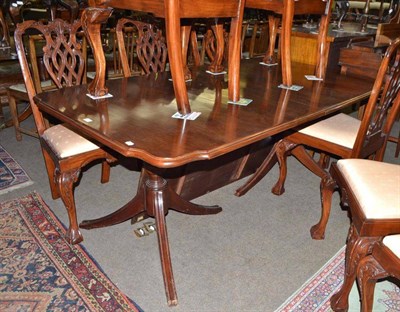 Lot 538 - Twin pillar dining table and a set of eight George III style dining chairs