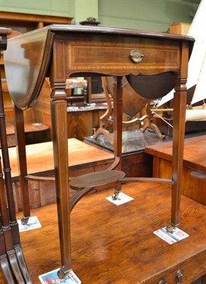 Lot 542 - Edwardian satinwood banded drop-leaf table