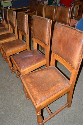 Lot 559 - Set of ten oak dining chairs, with leather upholstery and drop-in seats, labelled Christopher Pratt