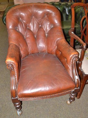 Lot 561 - Late Victorian leather upholstered armchair