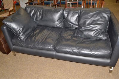 Lot 565 - Black leather sofa on chrome legs