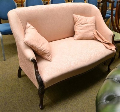 Lot 568 - A pink upholstered settee on cabriole legs