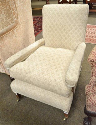 Lot 572 - Late 19th century armchair raised on square tapering legs and casters