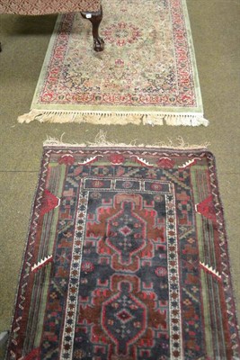 Lot 574 - Blue ground rug and two modern Persian design fringed rugs (3)