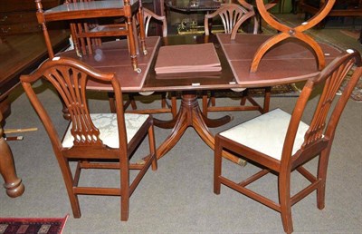 Lot 577 - Mahogany dining table, four chairs, extension leaf and table mats with table protector