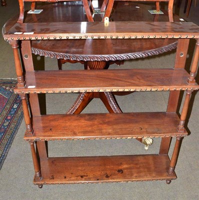 Lot 585 - Mahogany four tier wall shelves with turned supports