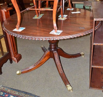 Lot 586 - Reproduction carved mahogany circular dining table