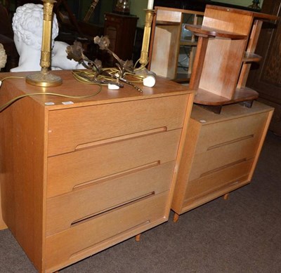 Lot 602 - An oak veneered four drawer chest, matching three drawer chest, three tier occasional table and two