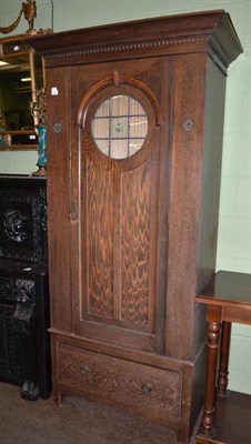 Lot 607 - Oak wardrobe with leaded glass panel and a drawer below