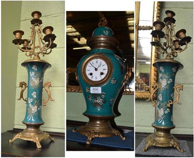 Lot 609 - A gilt metal and ceramic striking clock garniture