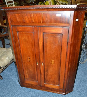 Lot 726 - George III mahogany corner cabinet