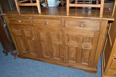 Lot 745 - Stained pine dresser base fitted three drawers and cupboard doors