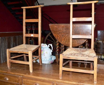 Lot 746 - Two children's rush seated ladder back prie dieu chairs