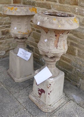 Lot 772 - A pair of 19th century campana garden urns on plinth bases, 117cm high