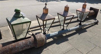 Lot 775 - Three late Victorian metal street lamp posts, one matching lantern and three associated copper...