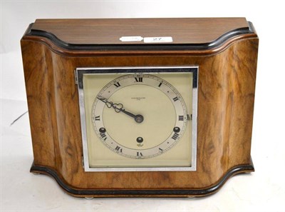 Lot 27 - An Art Deco walnut mantel clock retailed by W Greenwood & Sons, Leeds