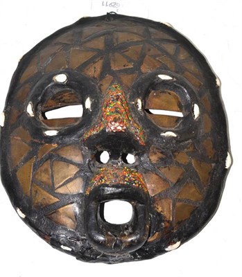 Lot 41 - An African brass inlaid mask with bead work nose and upper lip