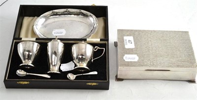 Lot 47 - A silver cigarette box, a cased silver condiment set and a Continental dish