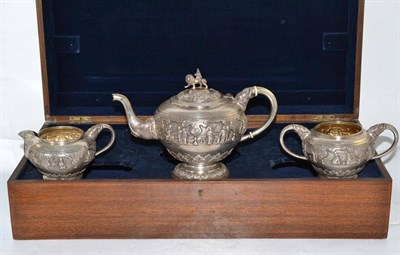 Lot 49 - An early 20th century Indian white metal three piece tea service with elephant head terminals, in a