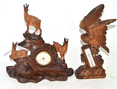 Lot 53 - A carved desk/mantel timepiece and a carved thermometer desk piece, inscribed base (2)