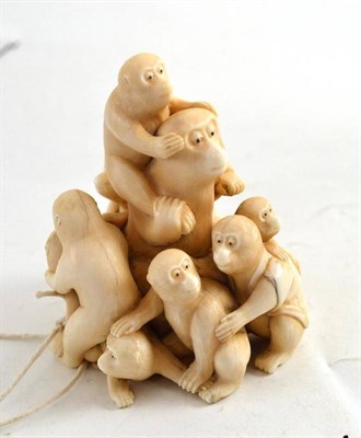 Lot 59 - A Japanese carved elephant ivory okimono as a group of apes, late Meiji period (1868-1912)