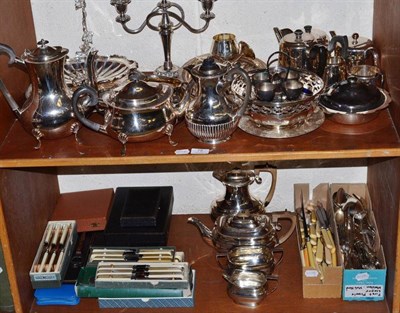 Lot 78 - Two shelves of silver plated ware including entree dish and cover, fruit stand, a candelabrum,  tea