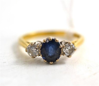 Lot 90 - An 18ct gold diamond and sapphire three stone ring