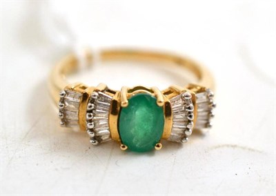Lot 95 - A 9ct gold emerald and diamond cluster ring
