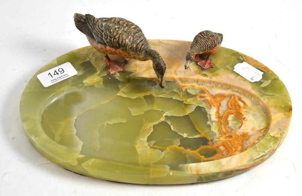 Lot 149 - An Austrian green onyx ashtray surmounted by two cold painted bronze figures of ducks