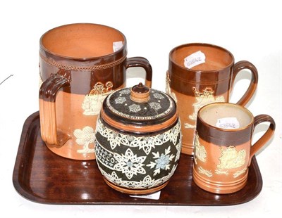 Lot 154 - A Doulton Lambeth stoneware tobacco jar and cover; a Royal Doulton stoneware tyg and two mugs
