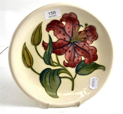 Lot 156 - A Moorcroft cream ground orchid decorated plate