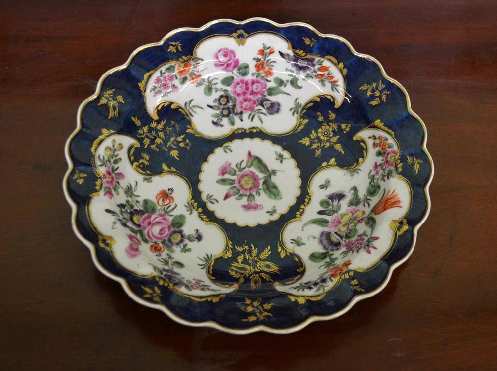 Lot 14 - A First Period Worcester Porcelain Plate, circa 1775, painted in colours with swags of flowers...