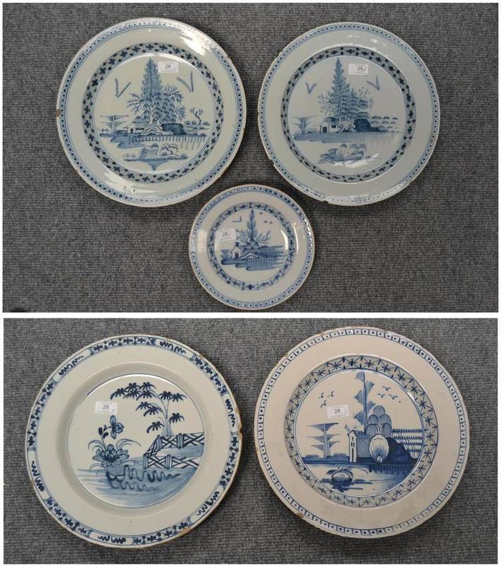 Lot 28 - An English Delft Charger, probably London, circa 1760, painted in blue with peony and bamboo in...